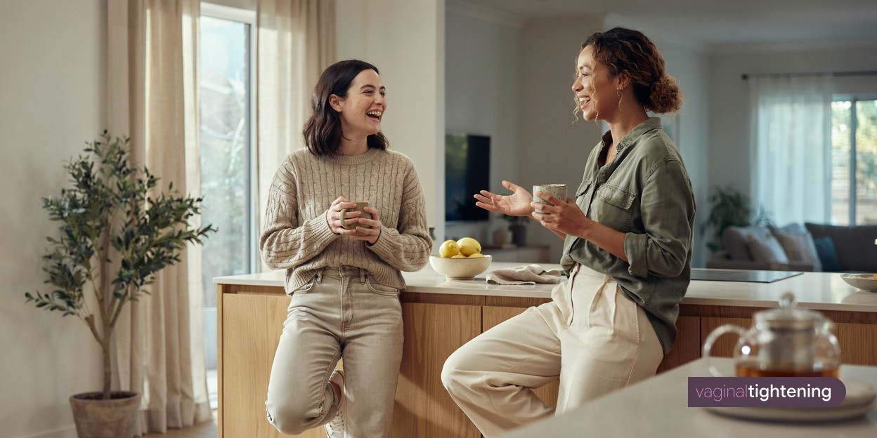 Two friends talking over cups of tea